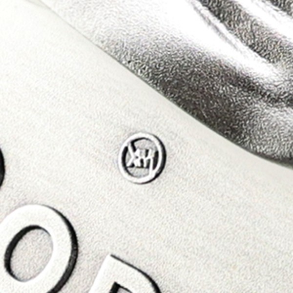 Close-up of the XceptionalMint XM privy mark